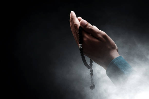 istock Muslim man praying with rosary beads 1388151823