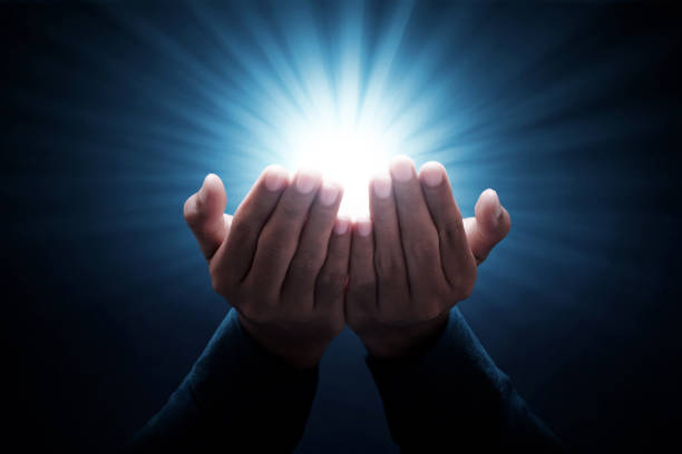 Muslim man praying on dark background