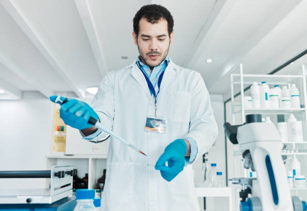 istock Shot of a young scientist working with samples in a lab 1388152323