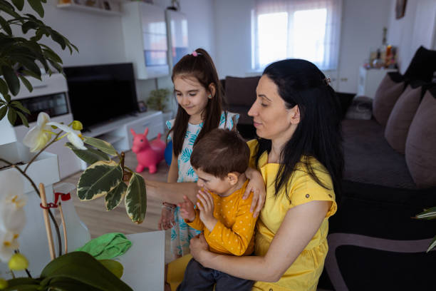 istock Kids learning from their mother about plants care 1388152532