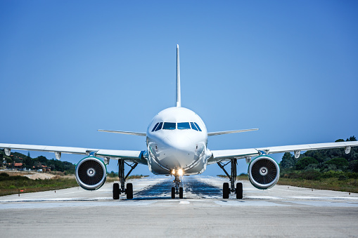 Airplane on tarmac preparing to take off from airport.