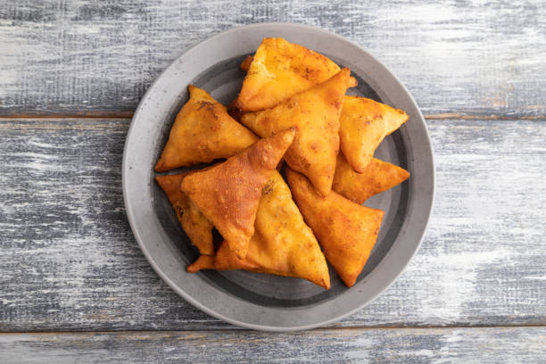 istock nachos on gray plate on a gray wooden background. Top view. 1388155018