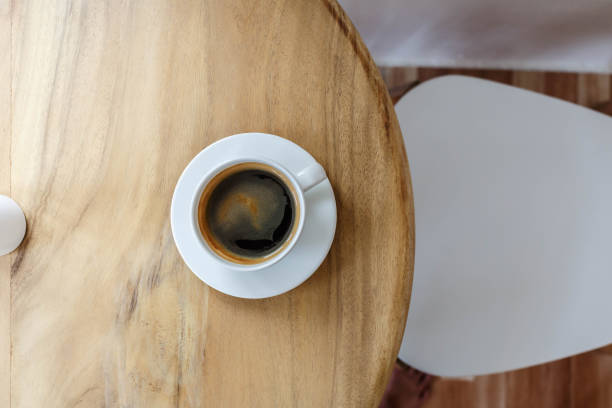 istock Hot black coffee on a wooden table in a cafe 1388157610