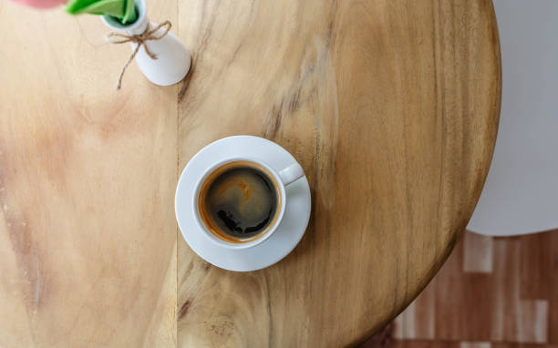istock Hot black coffee on a wooden table in a cafe 1388157616