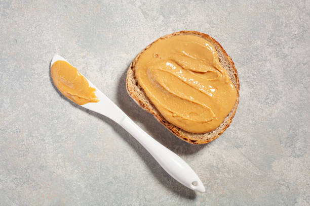 istock smooth peanut butter bread toast, healthy traditional sandwich 1388158687