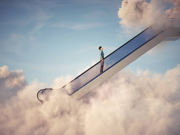 istock Man rises up on escalator into the clouds. 1388158804