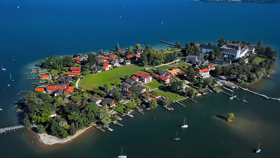 Aerial panorama of Frauenchiemsee island (Fraueninsel) in Chiemsee lake, Bavaria, Germany.