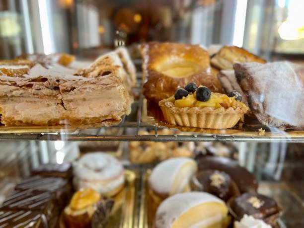 istock cakes on trays in a display case. cakes and mini cakes in a cafe-bar 1388159638