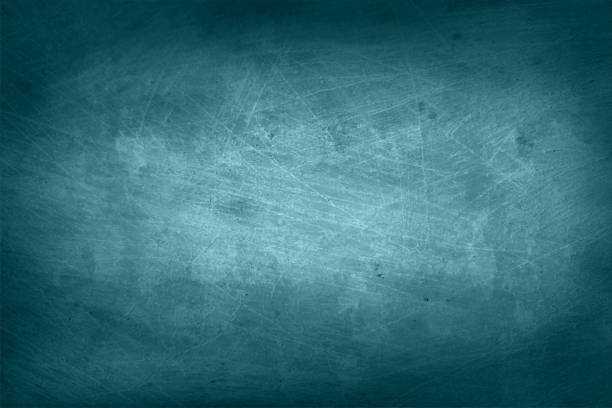 Empty blank blackboard like dark green tint grey black coloured grunge textured scratched vector backgrounds with scratches all over Old grunge black coloured spotted and textured grunge backgrounds - suitable to use as rustic backdrops, wallpaper, blackboard template. blackboard texture stock illustrations