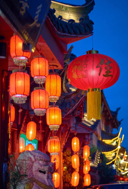 istock Red lanterns lit up on Chinese New Year Street. 1388162066