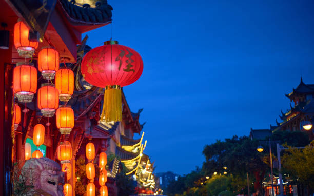 istock Red lanterns lit up on Chinese New Year Street. 1388162795