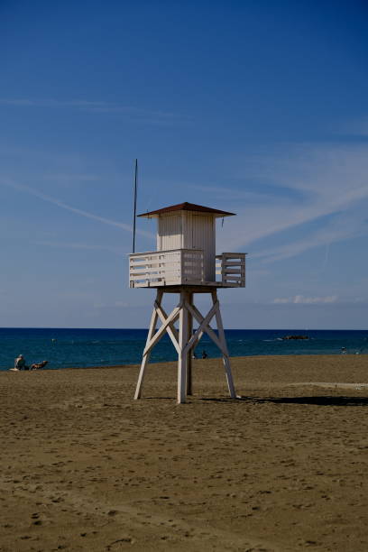 istock Lifeguard post under a blue sky on the beach 1388164026