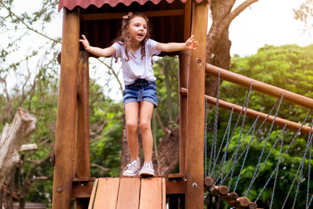 istock Little girl playing in a public park. 1388166138