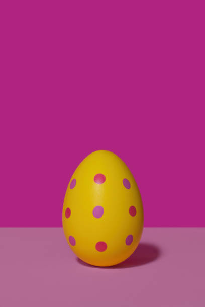 istock A yellow spotted Easter egg in 80s-90s retro style. 1388167293