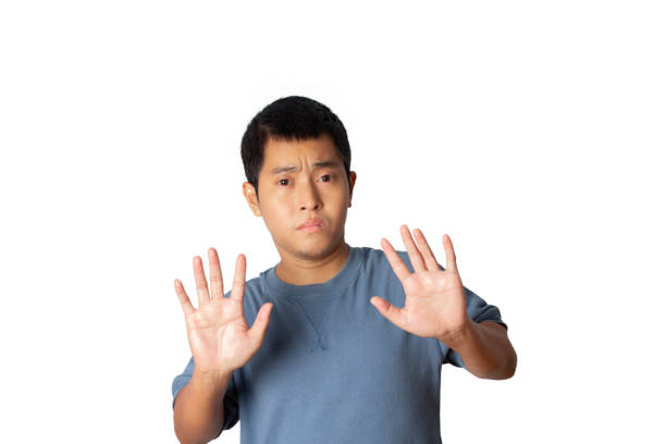 istock Man show stop gesture sign by hand, hands show refusal gesture. 1388168849
