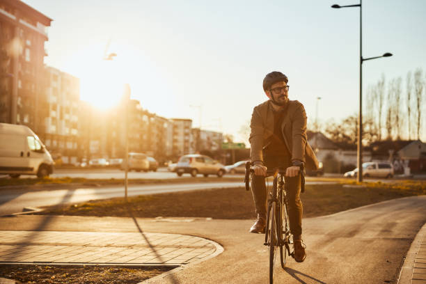 istock Businessman riding bicycle to workplace 1388169201