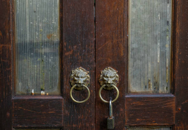 istock Brass lion heads door handles with lock 1388169271