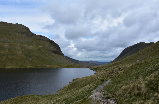 istock Beautiful Spring Day at Grisdale Tarn in England 1388170077