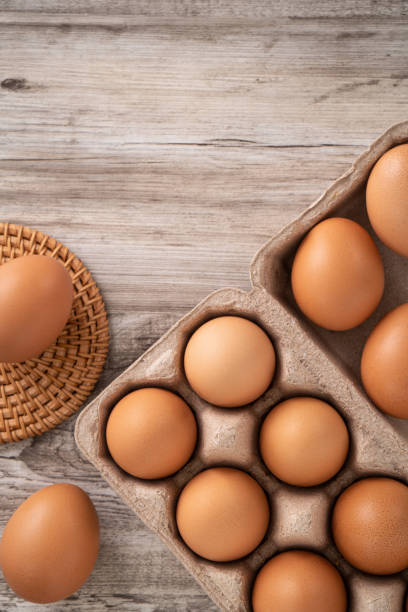 istock Fresh brown chicken eggs in a kraft paper egg carton. 1388171665