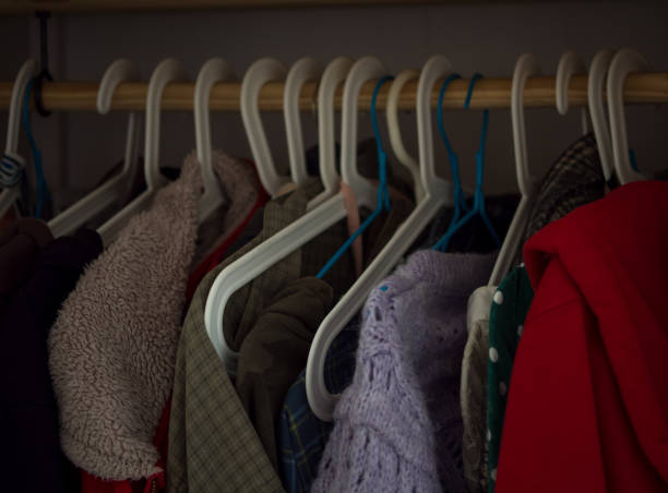 istock hangers with different clothes in the home wardrobe 1388171709