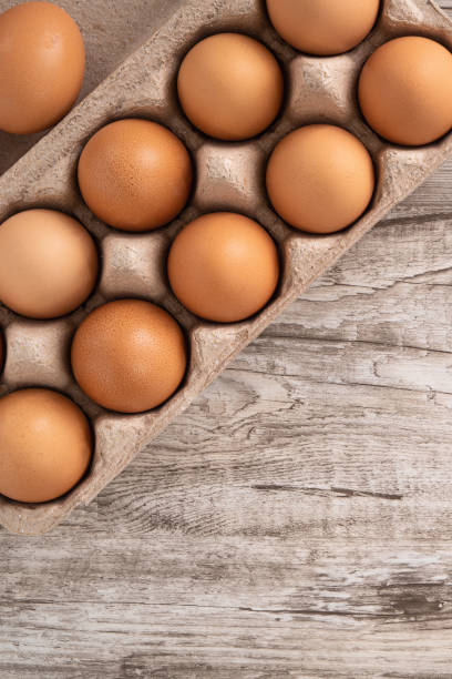 istock Fresh brown chicken eggs in a kraft paper egg carton. 1388171972