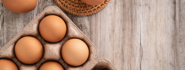 istock Fresh brown chicken eggs in a kraft paper egg carton. 1388171978