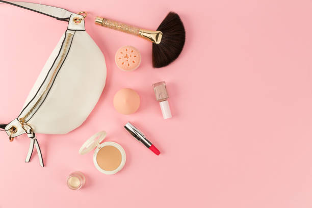 istock cosmetics and bag on pink background 1388174293