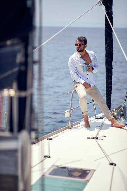 istock Casual good-looking man sailing alone; Luxurious lifestyle concept 1388175258