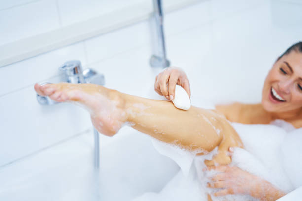 istock Young nice brunette woman having bath in bathtub 1388175344