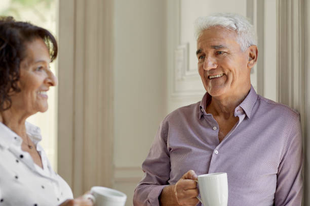 istock Elderly couple having coffee at home in lockdown 1388175907