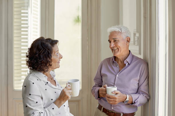 istock Senior couple having coffee at home in lockdown 1388175938