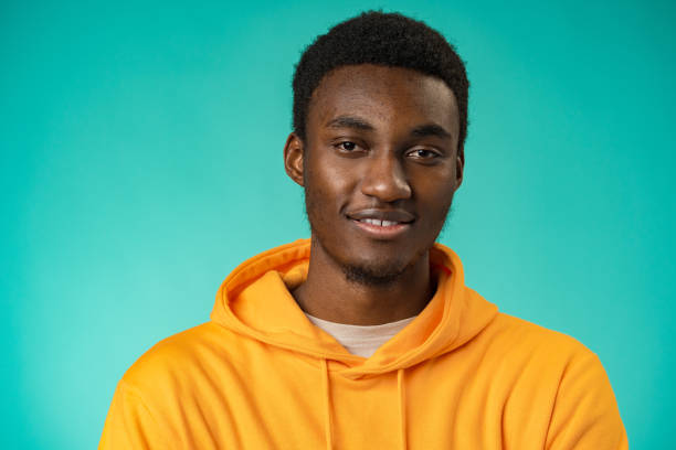 istock Handsome smiling young african man standing in studio 1388176085