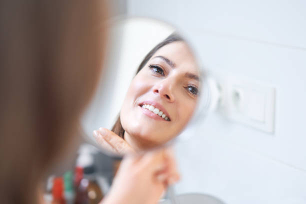 istock Young nice brunette woman in the bathroom 1388176127