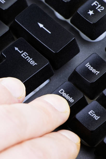 istock Black keyboard. Hand on a keyboard. Work at home. Make maoney.Select focus.Vertical orientation 1388176302