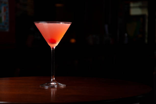 istock cosmopolitan cocktail on wooden table and dark background 1388176307
