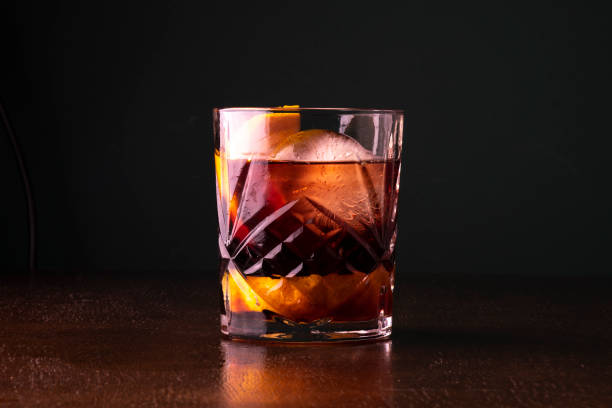Negroni cocktail on wooden table and dark background Negroni cocktail on wooden table and dark background vermouth stock pictures, royalty-free photos & images