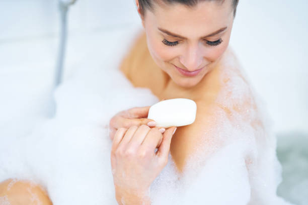 istock Young nice brunette woman having bath in bathtub 1388176913