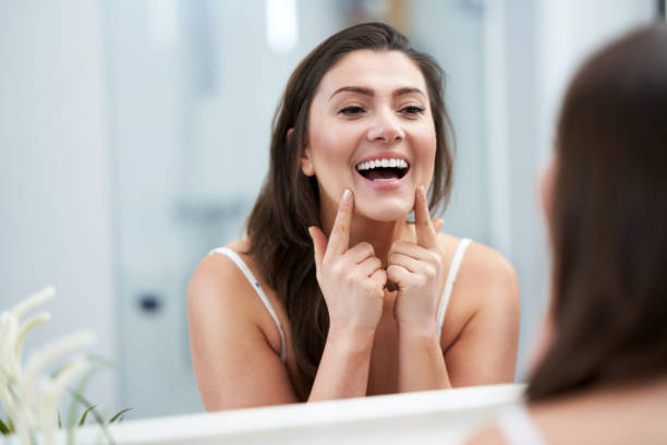 istock Young nice brunette woman in the bathroom 1388177727