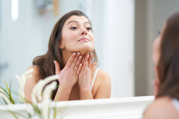 istock Young nice brunette woman in the bathroom 1388177875