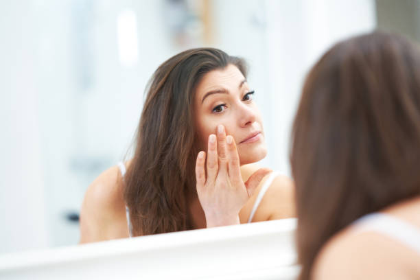 istock Young nice brunette woman in the bathroom 1388178231