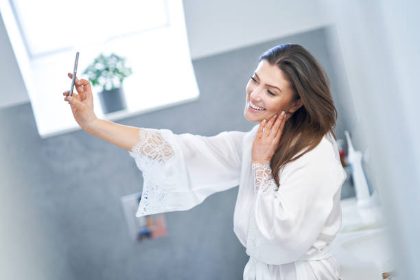 istock Young nice brunette woman in the bathroom 1388178429