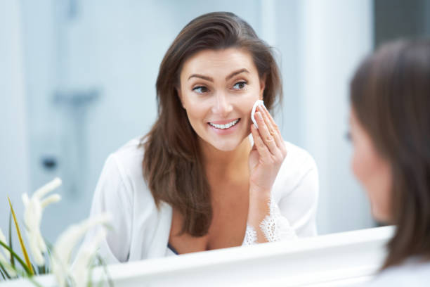 istock Young nice brunette woman in the bathroom 1388179321