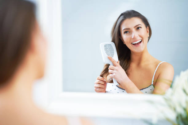 istock Young nice brunette woman in the bathroom 1388179997