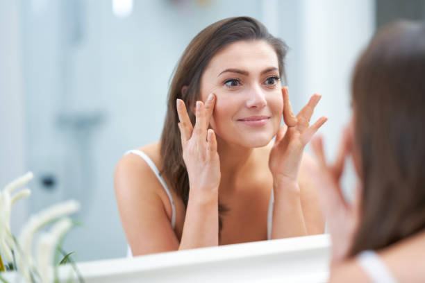 istock Young nice brunette woman in the bathroom 1388180140