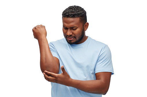 health problem and people concept - unhealthy african american man suffering from pain in hand over white background