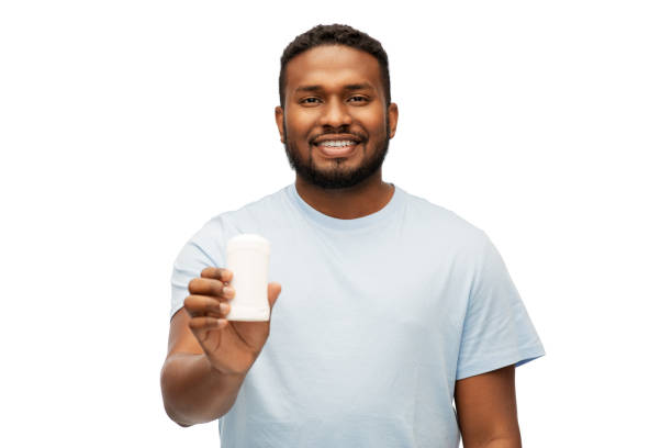 istock african american man with antiperspirant deodorant 1388181848