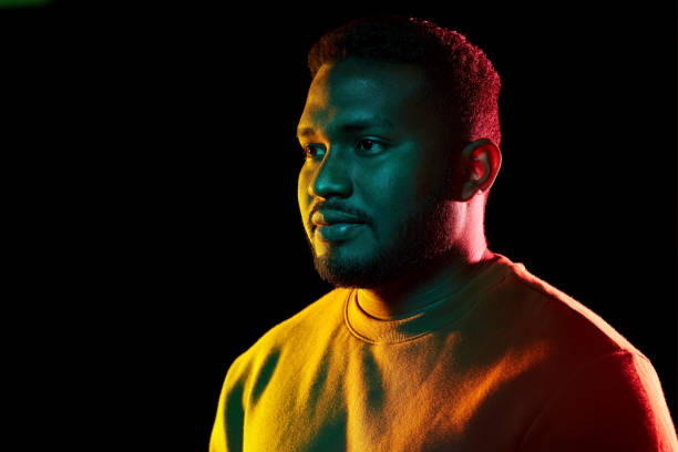 istock young african american man over black background 1388183021