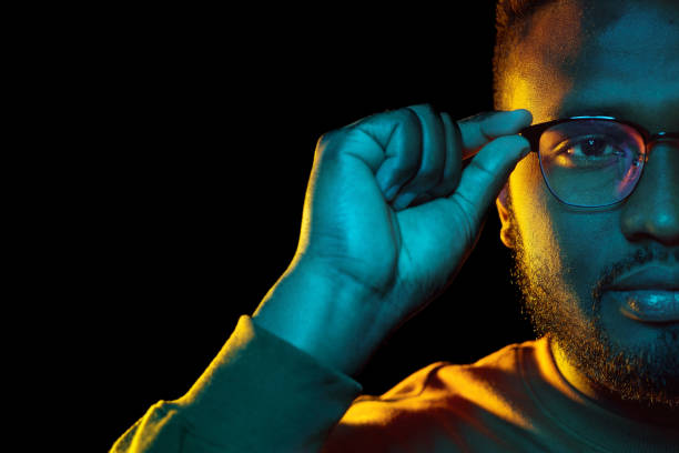 istock young african american man in glasses over black 1388183038