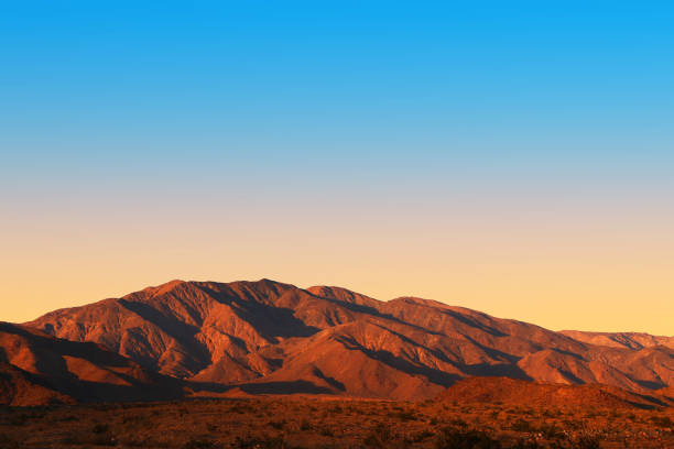 a sunset evening dusk desert mountain shadows dry aired landscape
