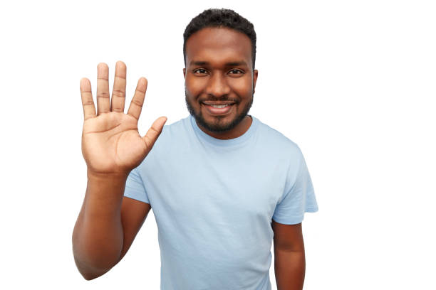 istock smiling african american young man waving hand 1388183289